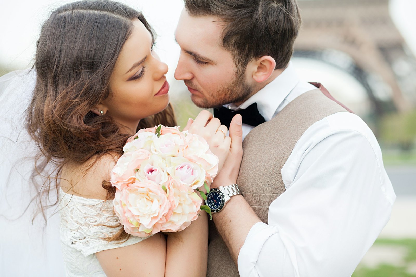 Young wedding couple enjoying romantic moments outside on a summer meadow